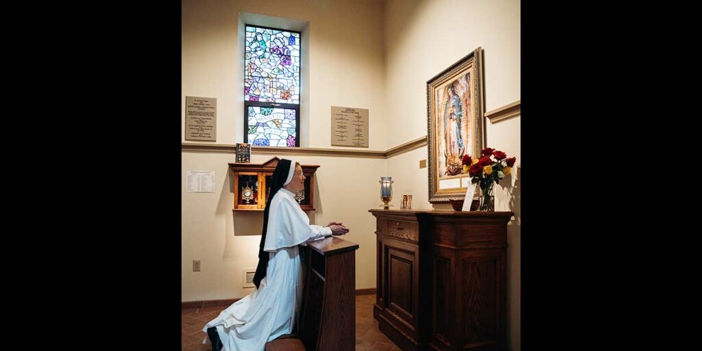 Sister praying in chapel
