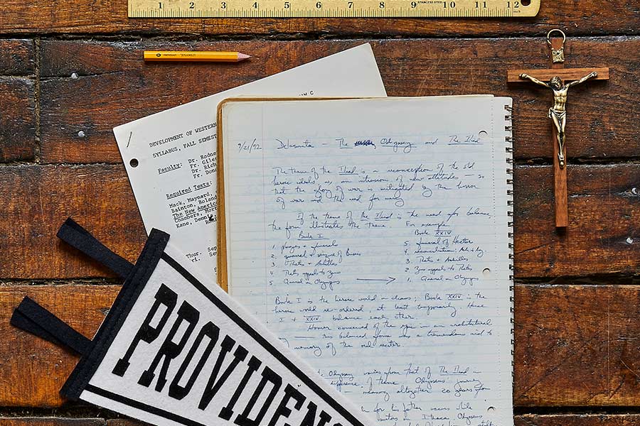 crucifix, pennant, and notebook