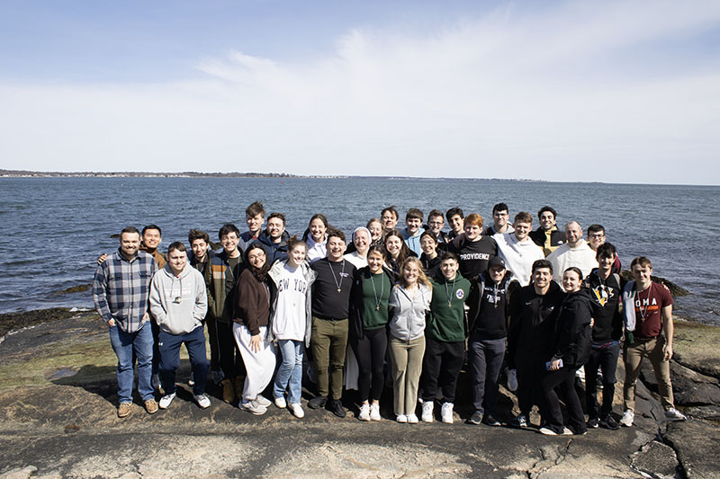 group photo in front of ocean from Encounter Retreat