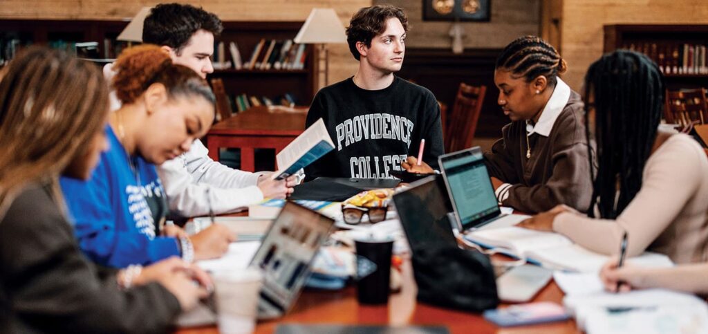 Students study together at a large table